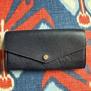 Classic Louis Vuitton long wallet in Gorgeous Navy with Red edges